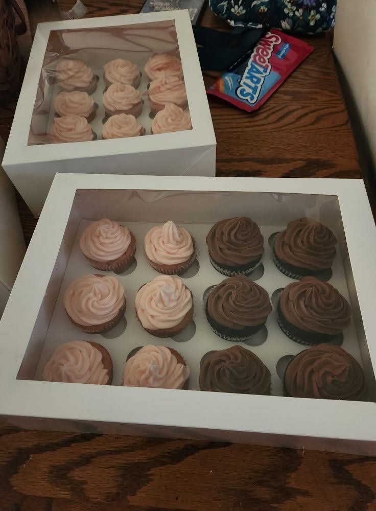 Rich frosted cupcakes in a batch